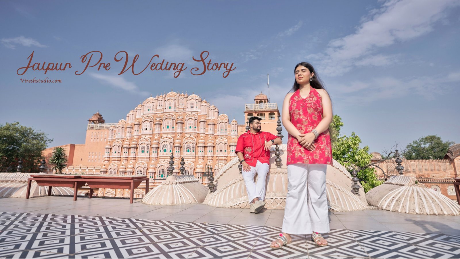 Couple posing near Hawa Mahal heritage rooftop for pre-wedding in Jaipur