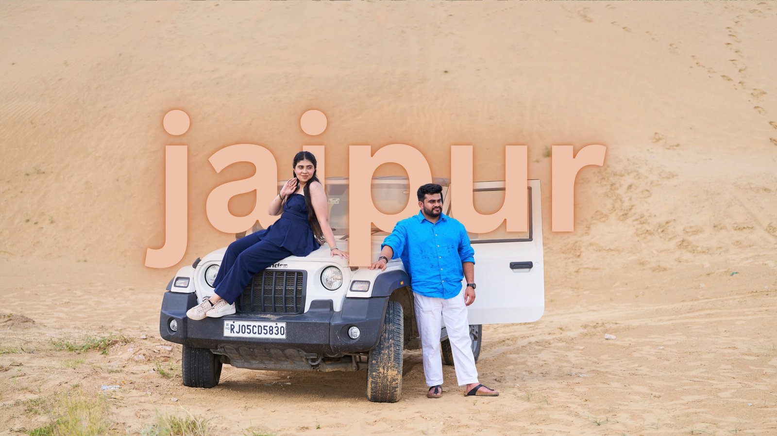 Romantic pre-wedding photography at desert sand dunes with 4x4 Thar in Jaipur